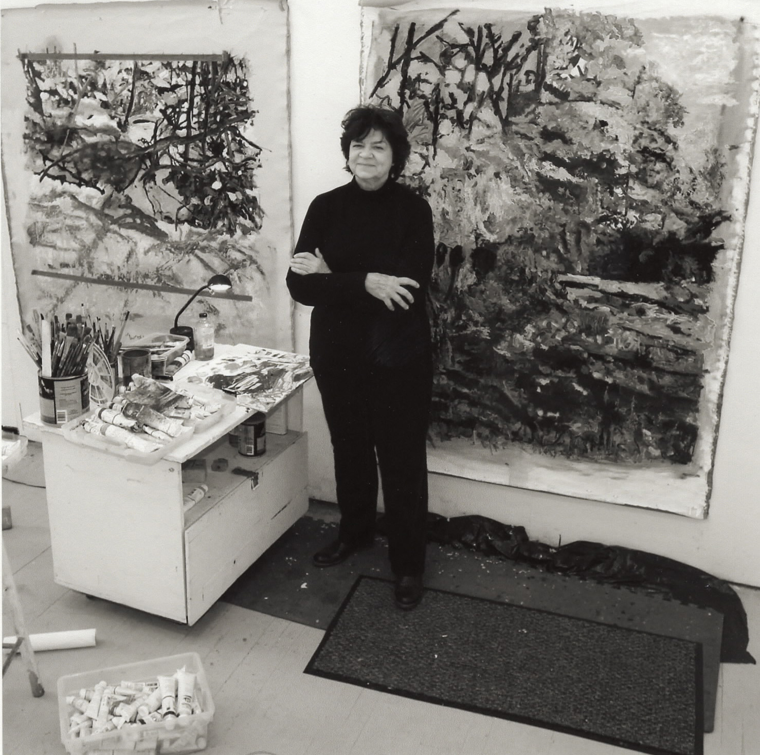 A woman stands in an art studio